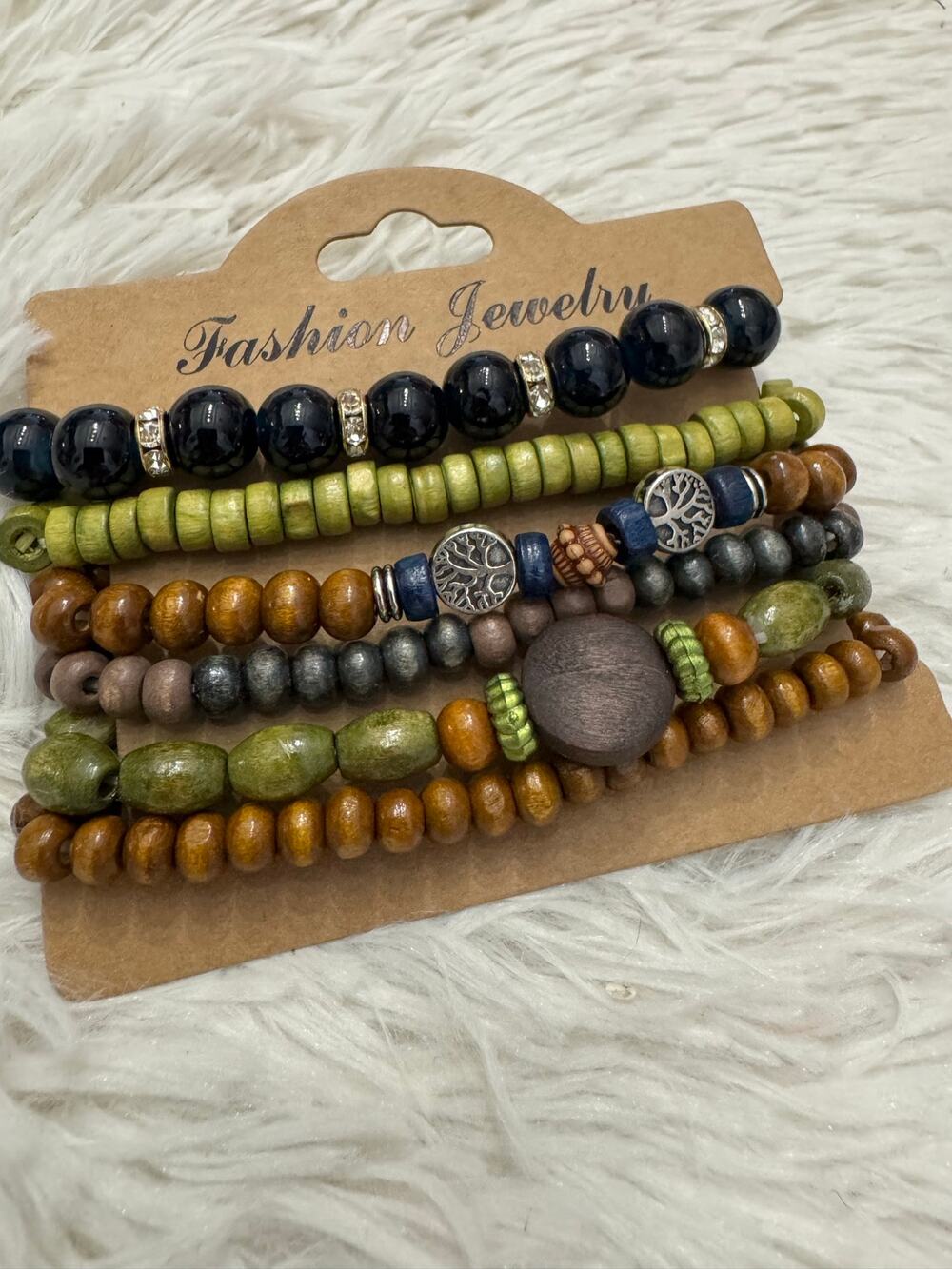 Wooden Bead bohemian Bracelet Set of 6
Multi-colored with tree of life charms